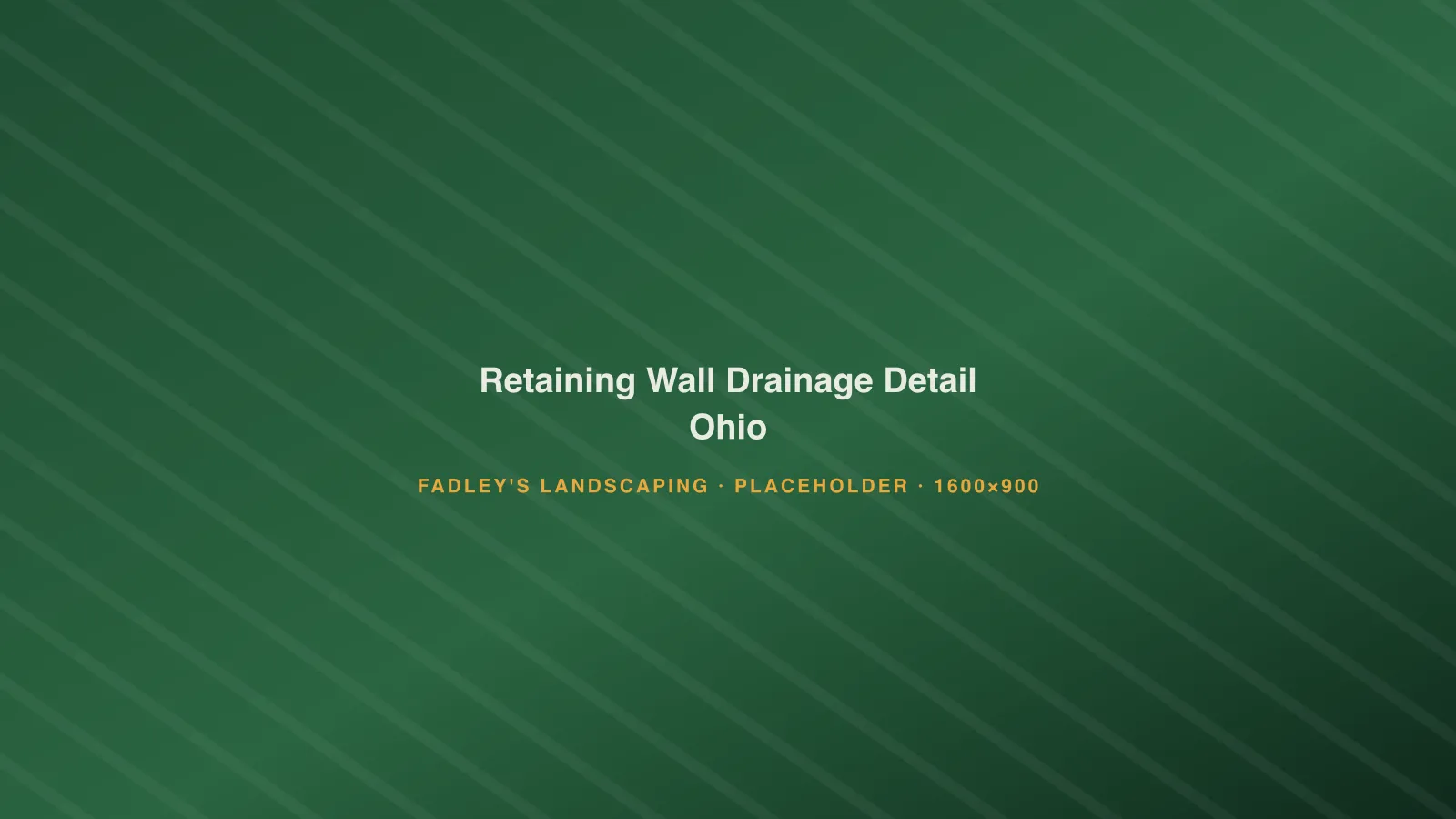 Cross-section of a segmental retaining wall showing drain tile and clean stone backfill in Ohio